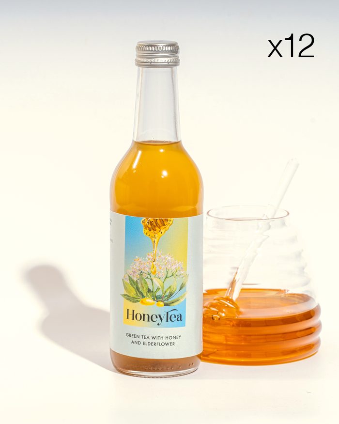 A bottle of HoneyTea beside a jar of honey, twelve-pack subscription